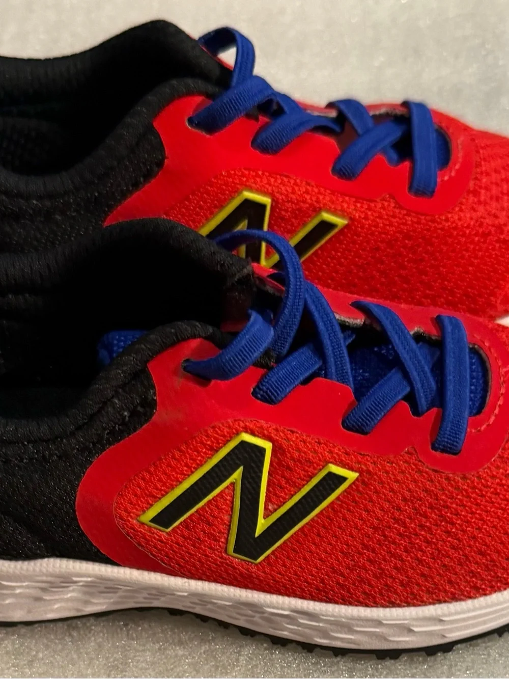 New Balance Red Kids Sneakers with Blue Laces